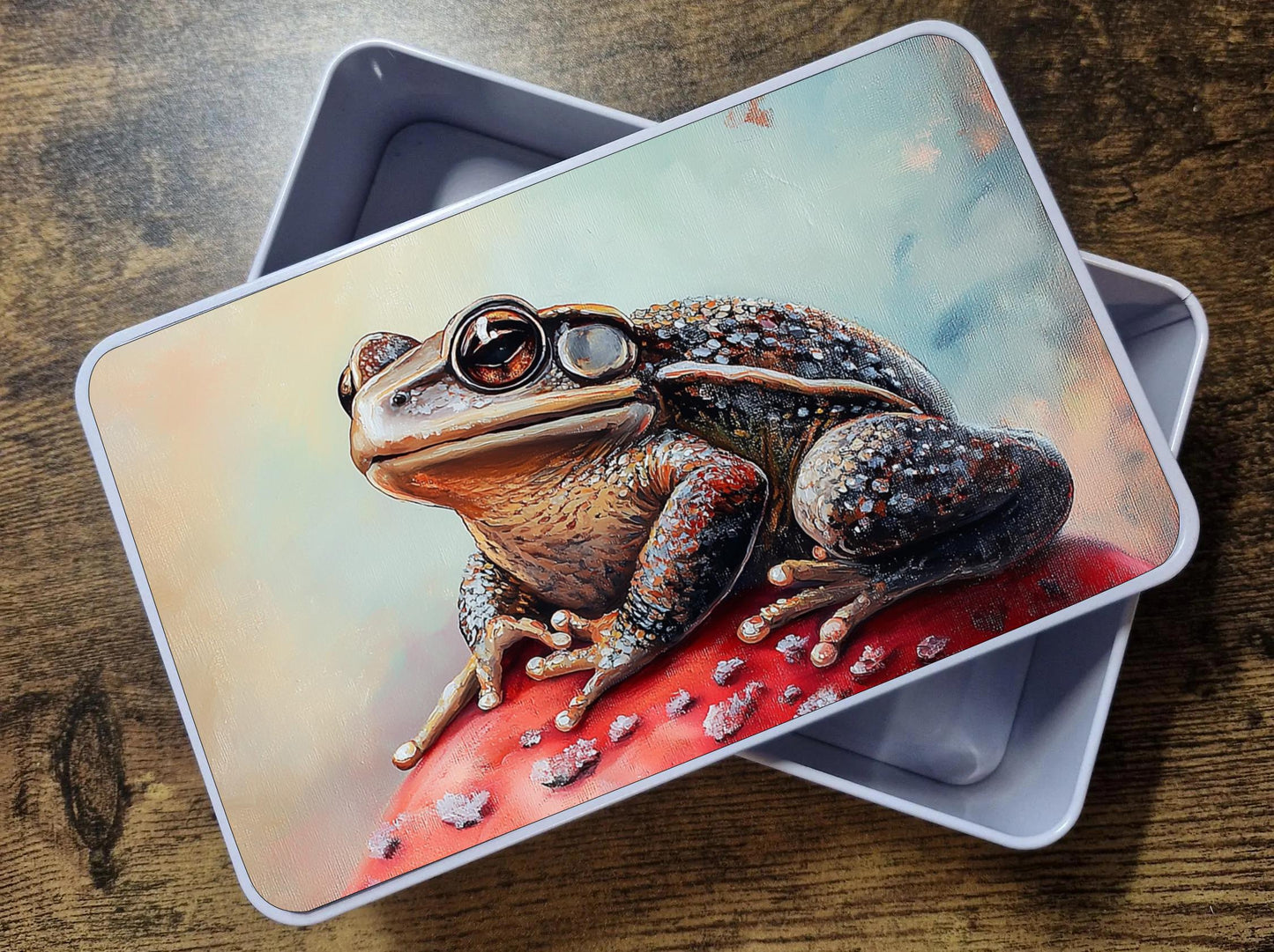 Storage tin with mushroom and toad printed top panel